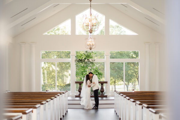 Bride and groom in indoor wedding venue chapel