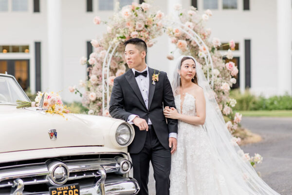 classic romance wedding style portrait with vintage car